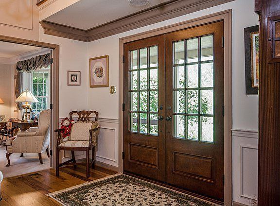 Entry Foyer with Custom Doors & Wainscotting