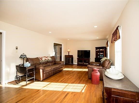 Living room has beautiful hardwood floors.  Access to kitchen, dining room and lower level family room.