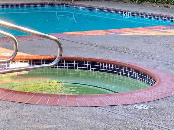 Jacuzzi and pool about 100 steps from home