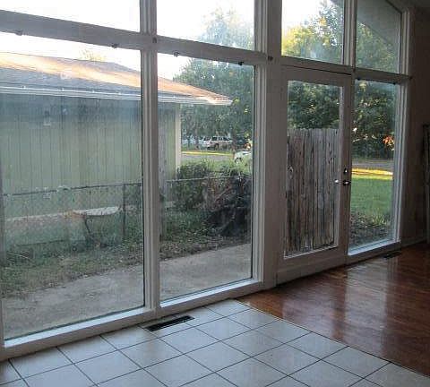 Window wall in living room and open to the kitchen.