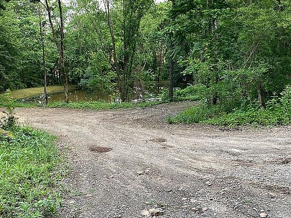 Dozed road through land