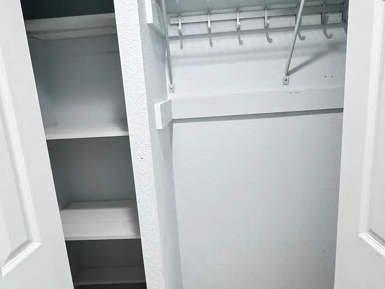 Front door entrance with closet and storage space