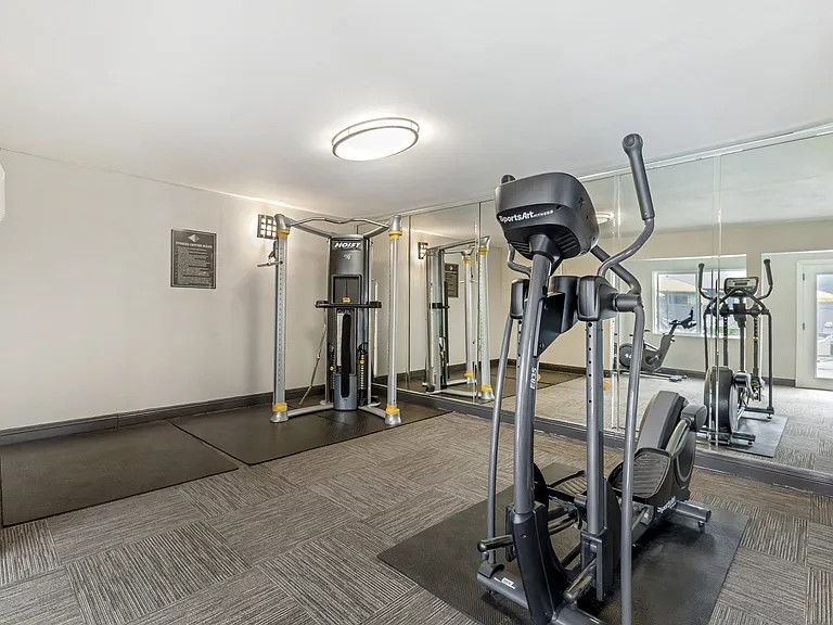 Transform your workout routine in our newly remodeled gym, where sleek glass walls offer inspiring views as you break a sweat with our state-of-the-art weights and cardio equipment.