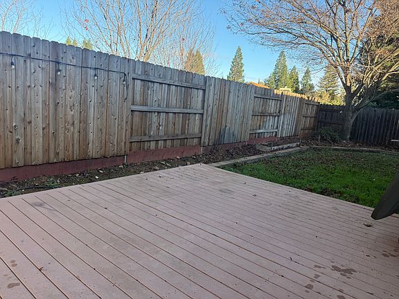 Backyard deck and grass area.