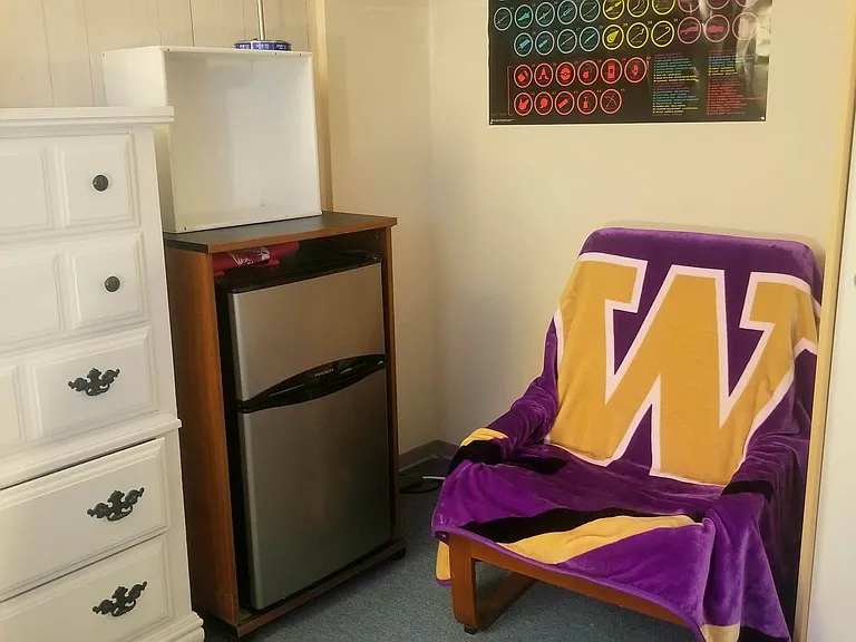 Ivory Room - Mini Fridge, Lamp, Dresser, Lounge Chair.