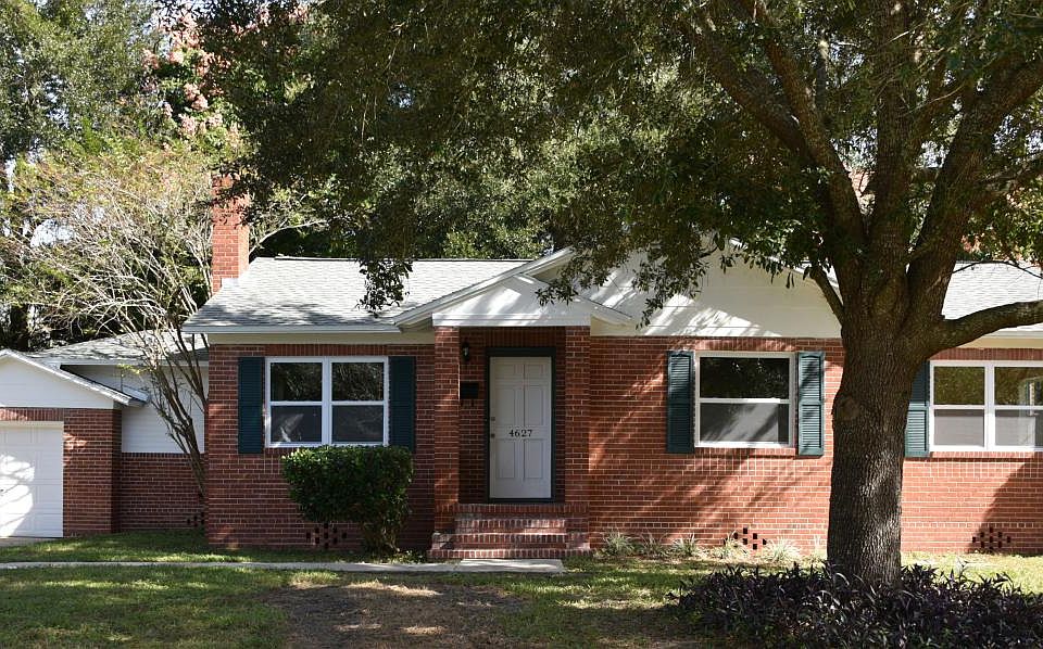 Attached garage, long driveway, sidewalk, rear patio & new roof, double pane E-glass windows, paint