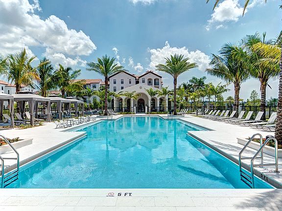 Resort Style Pool with Private Cabanas and Expansive Sunning Deck