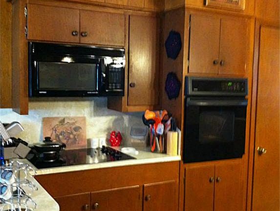 recent smooth top range with microwave above plus oven