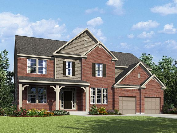 two-story home with brick and shakes