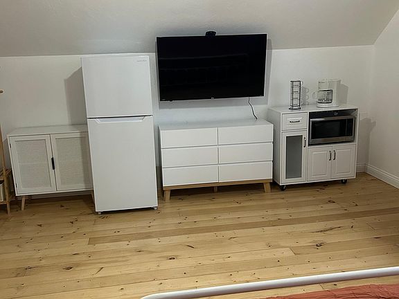 Fridge, 50" Smart Roku TV, Dresser, Hanging Rack, Coffee Station, and Microwave! (you would also have access to a full to the shared kitchen on the first floor)