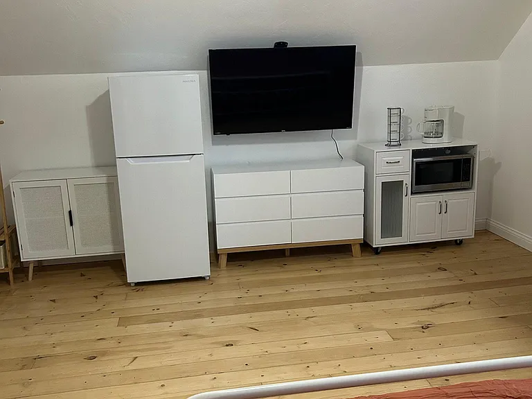 Fridge, 50" Smart Roku TV, Dresser, Hanging Rack, Coffee Station, and Microwave! (you would also have access to a full to the shared kitchen on the first floor)