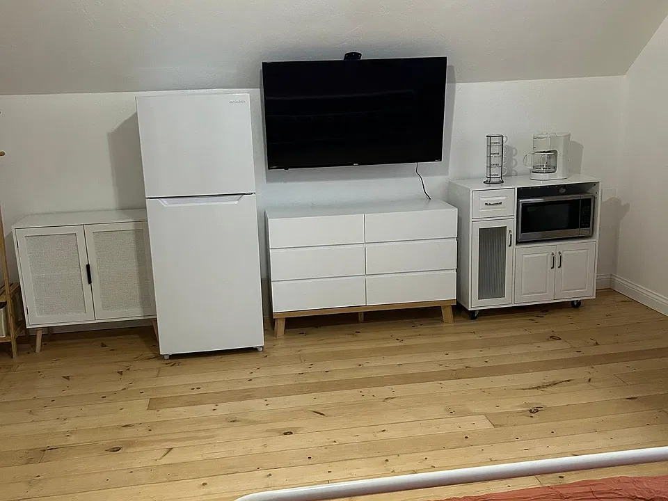 Fridge, 50" Smart Roku TV, Dresser, Hanging Rack, Coffee Station, and Microwave! (you would also have access to a full to the shared kitchen on the first floor)