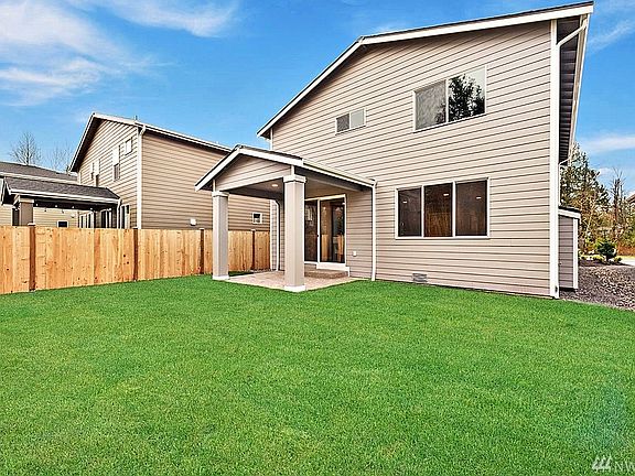 Example of Covered Patio on Plan 2101 - covered patios are subject to lot restrictions. Backyard depth varies by lot. Photo is not representation of yard size. 