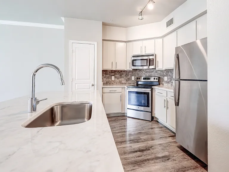 Marble countertops and deep garden kitchen sink