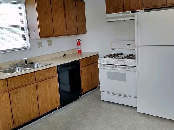 KITCHEN HAS STOVE, REFRIGERATOR , DISHWASHER