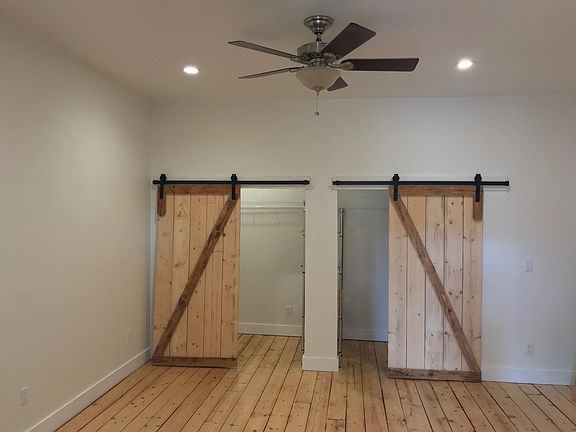 Large walk in closed with barn doors.