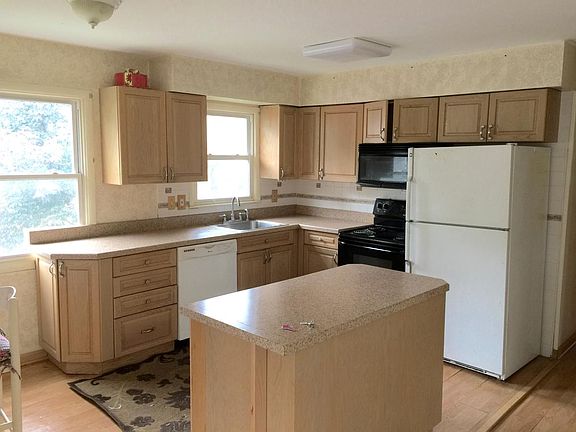 Kitchen w Island Microwave Refrigerator