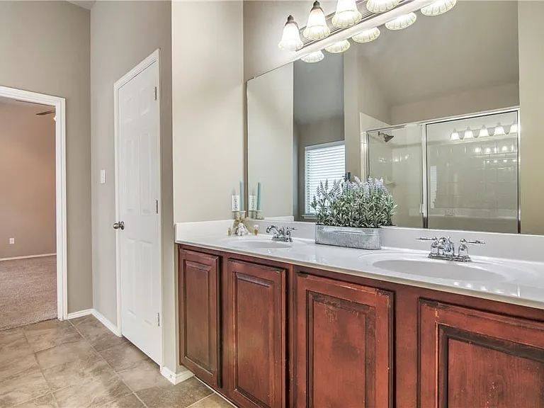 Master bathroom has double sinks and shower and tub.