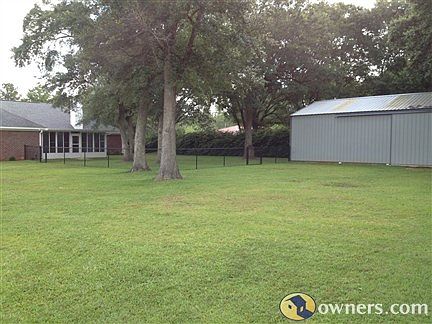 Back yard with big oak trees for plenty  of shade