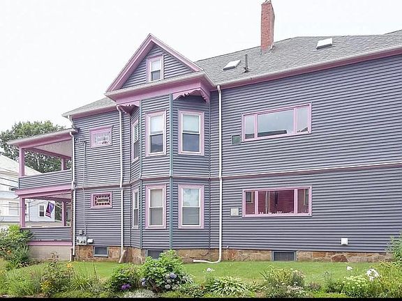 Side view of large colonial 2-family.