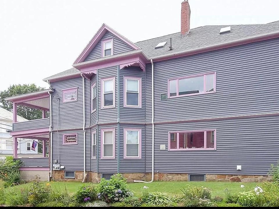 Side view of large colonial 2-family.