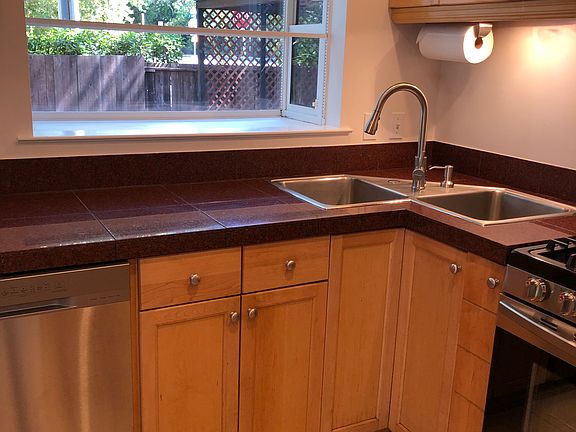 Kitchen sink with pocket window looking out on the deck and covered patio area