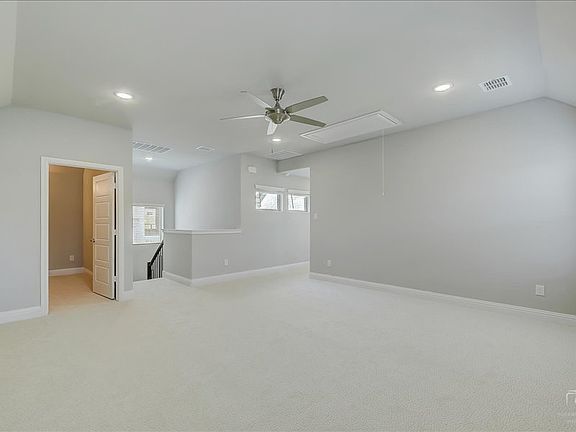 Game room in the Merlot home plan by Trophy Signature Homes - REPRESENTATIVE PHOTO