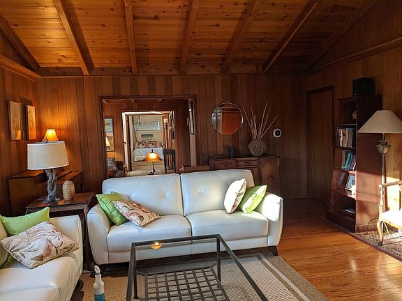 Original mid-century living room and den looking toward the third bedroom