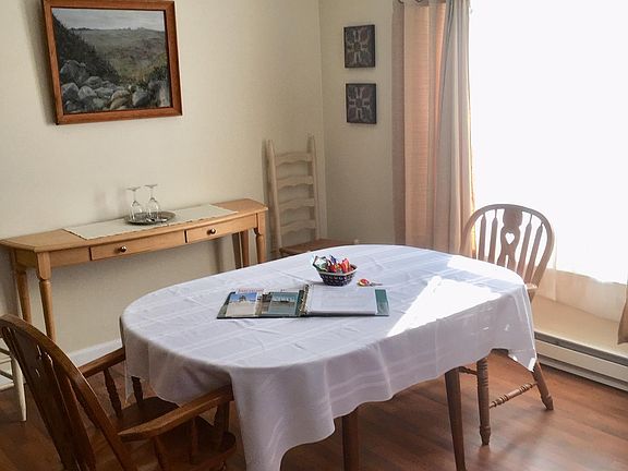 The dining area of the apartment has great south-facing windows that let in lots of natural light. On a clear day you can see the windmills on Mars Hill from these windows.
