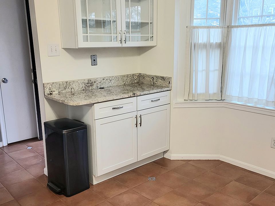 Additional granite countertop, bay window and space for table and chairs
