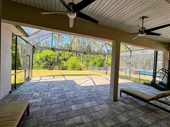 Private preserve lot. Screened large lanai. Large covered area with ceiling fans.