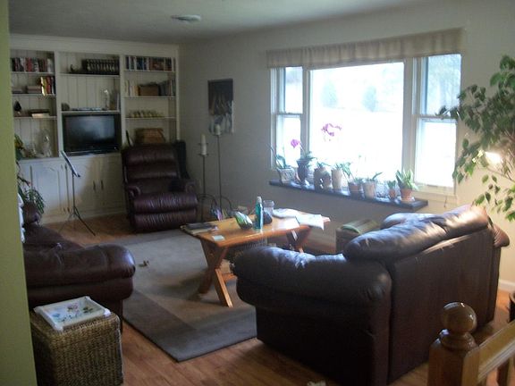 Living Room with custom-made wall shelving.