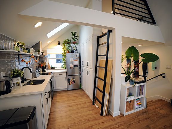 Kitchen has stainless steel appliances, including dishwasher
