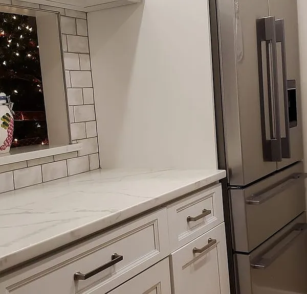 Pass through to dining room/living room. European refrigerator with wine-chilling feature, ice maker, and in-door filtered water