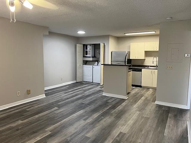 Great room, kitchen and dining area and washer dryer
