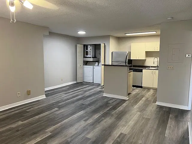 Great room, kitchen and dining area and washer dryer