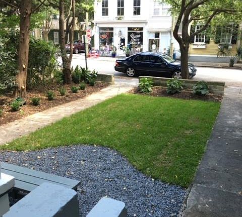 View from the front porch over looking the front yard. Queen Street Grocery is located on the corner and in view of this picture.