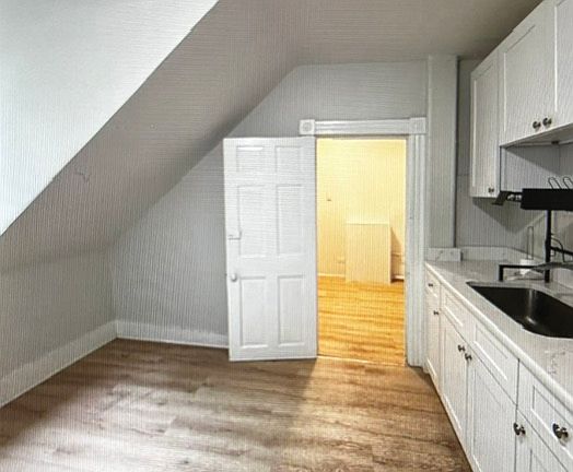 Kitchen counter with view to large bonus room