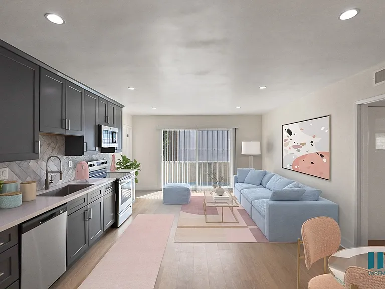 Open-Concept Kitchen with Stainless-Steel Refrigerator, Dishwasher, Stove, and Microwave Oven