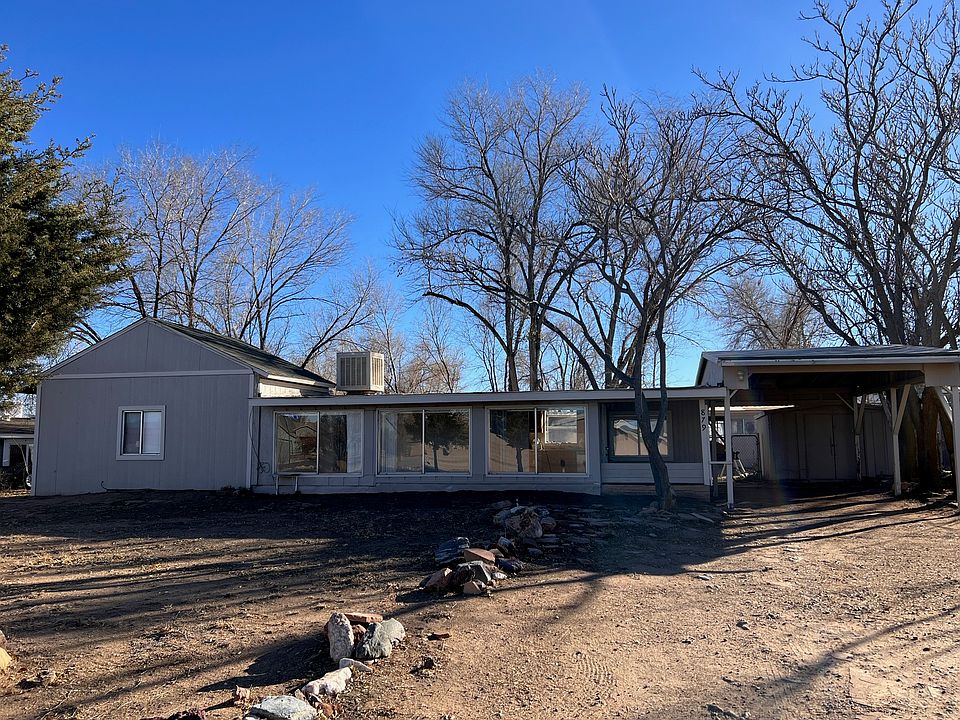 Front of home with carport
