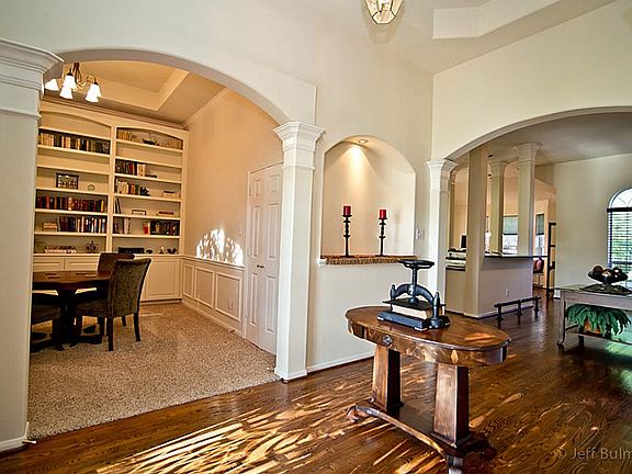 Open entry with high ceilings and real wood floors.