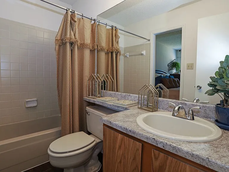 Clean and well-maintained bathroom with updated fixtures and ample counter space