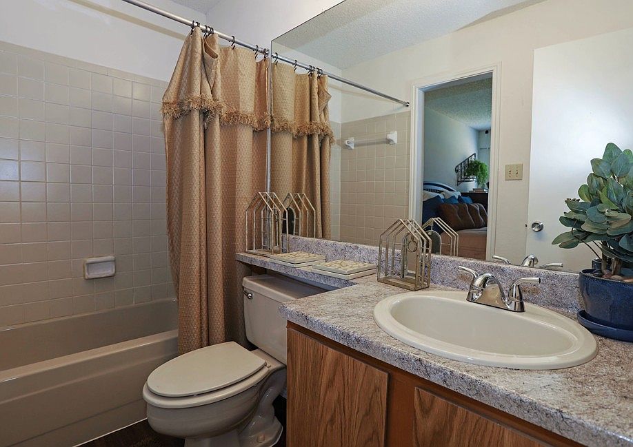 Clean and well-maintained bathroom with updated fixtures and ample counter space
