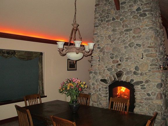 Dining area : See-through Russian-style fireplace connects dining area to living room.