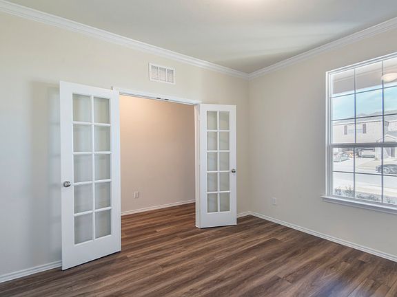 Study off entry with french doors.