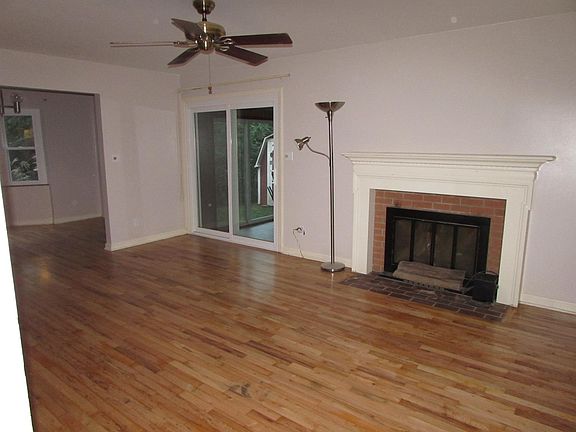 Living room with access to 3 season room and two car garage.