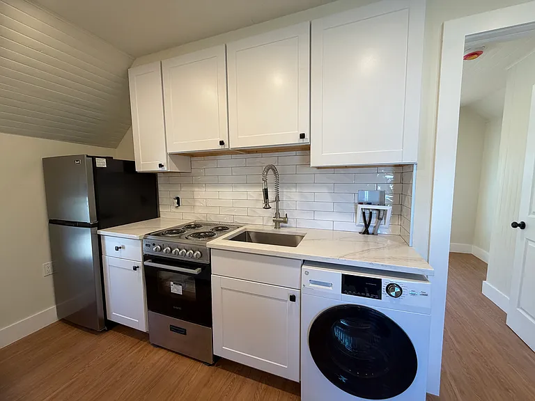 Beautiful Renovated Kitchen w/quartz countertops and stainless steel appliances