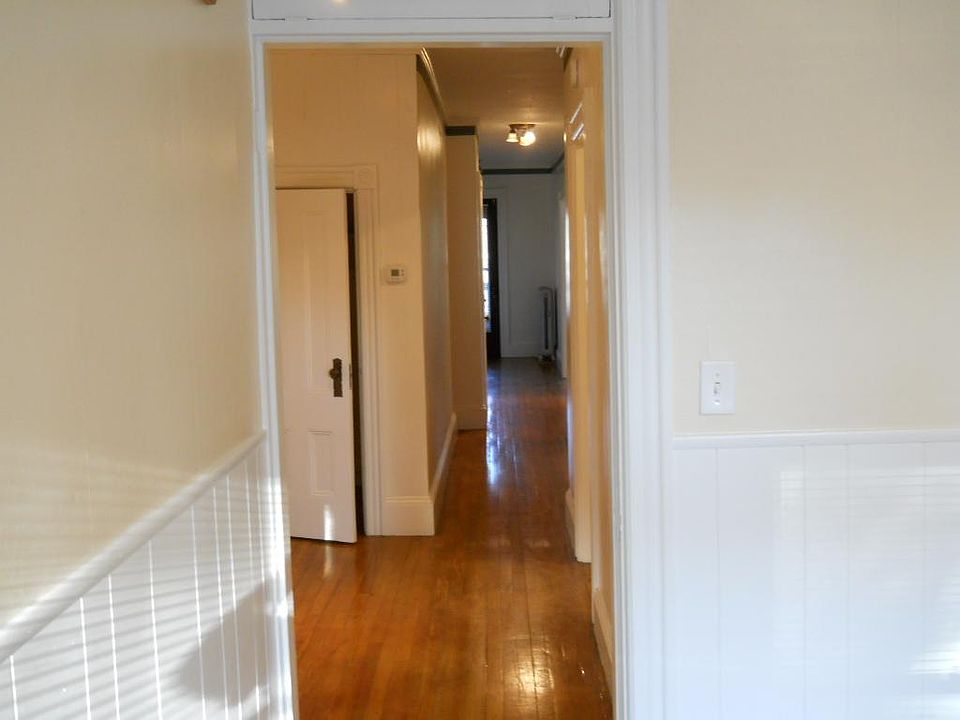 Looking from kitchen to small office area with closet