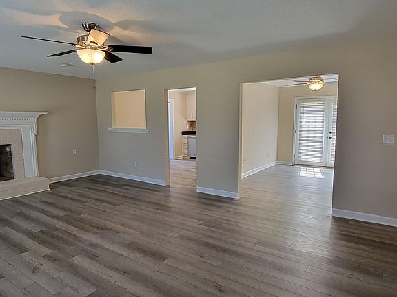 Kitchen entrance on left, dining room on the right with french doors to the deck.