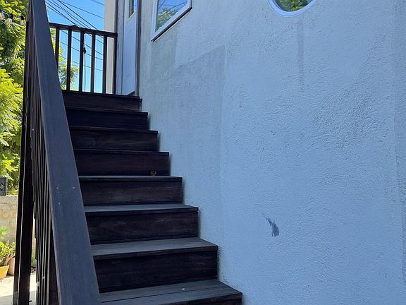Entry stairs to the front door. Laundry hook ups under the pictured stairs.